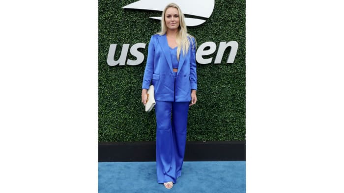 Lindsey Vonn poses at the US Open in a blue silk set.
